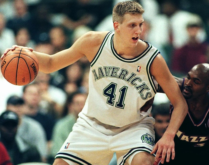 DALLAS, UNITED STATES:  Dirk Nowitzki (L) of the Dallas Mavericks works towards the basket...