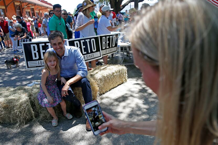 Chrissy Kleberg takes pictures of  her daughter Kathrine Kleberg, 5, left, and U.S. Rep....