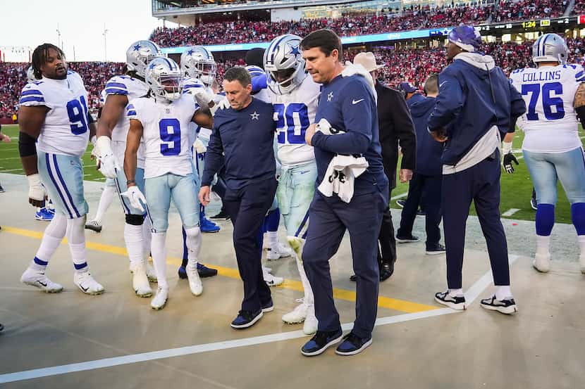 Cowboys running back Tony Pollard (20) leaves the field after being injured during the first...
