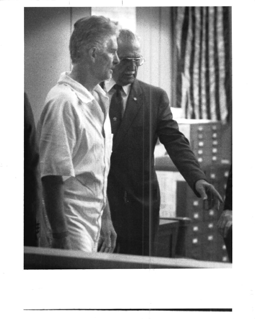 Charles Albright enters Judge Phil Barker's courtroom for a pretrial hearing in April 1991...