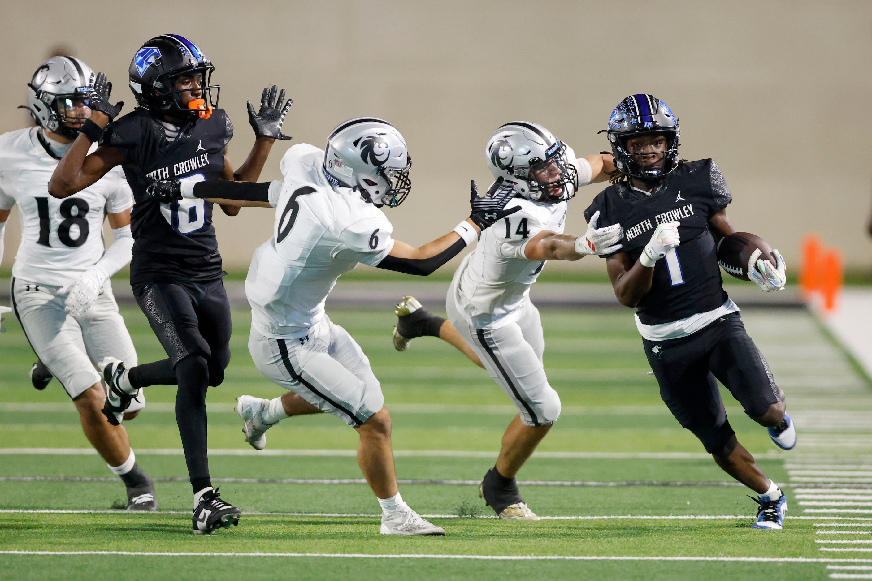 North Crowley linebacker Cornelius Warren (1) runs down the sideline as Denton Guyer...