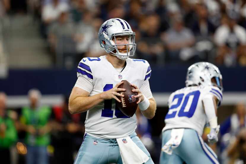 Dallas Cowboys quarterback Cooper Rush (10) looks to pass during an NFL football game...