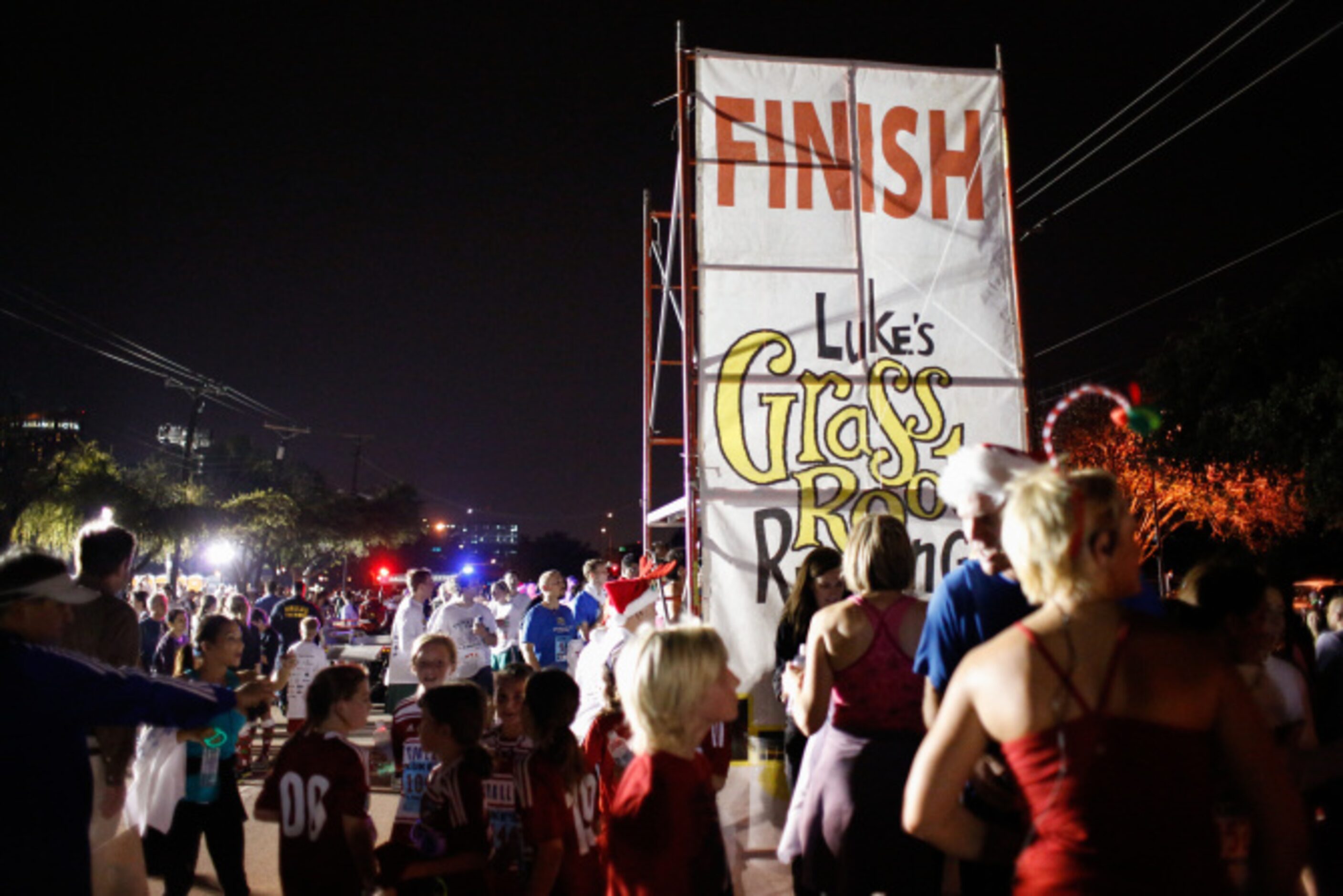 Thousands of runners take the streets for the Jingle Bell Run outside the Hilton Anatole in...