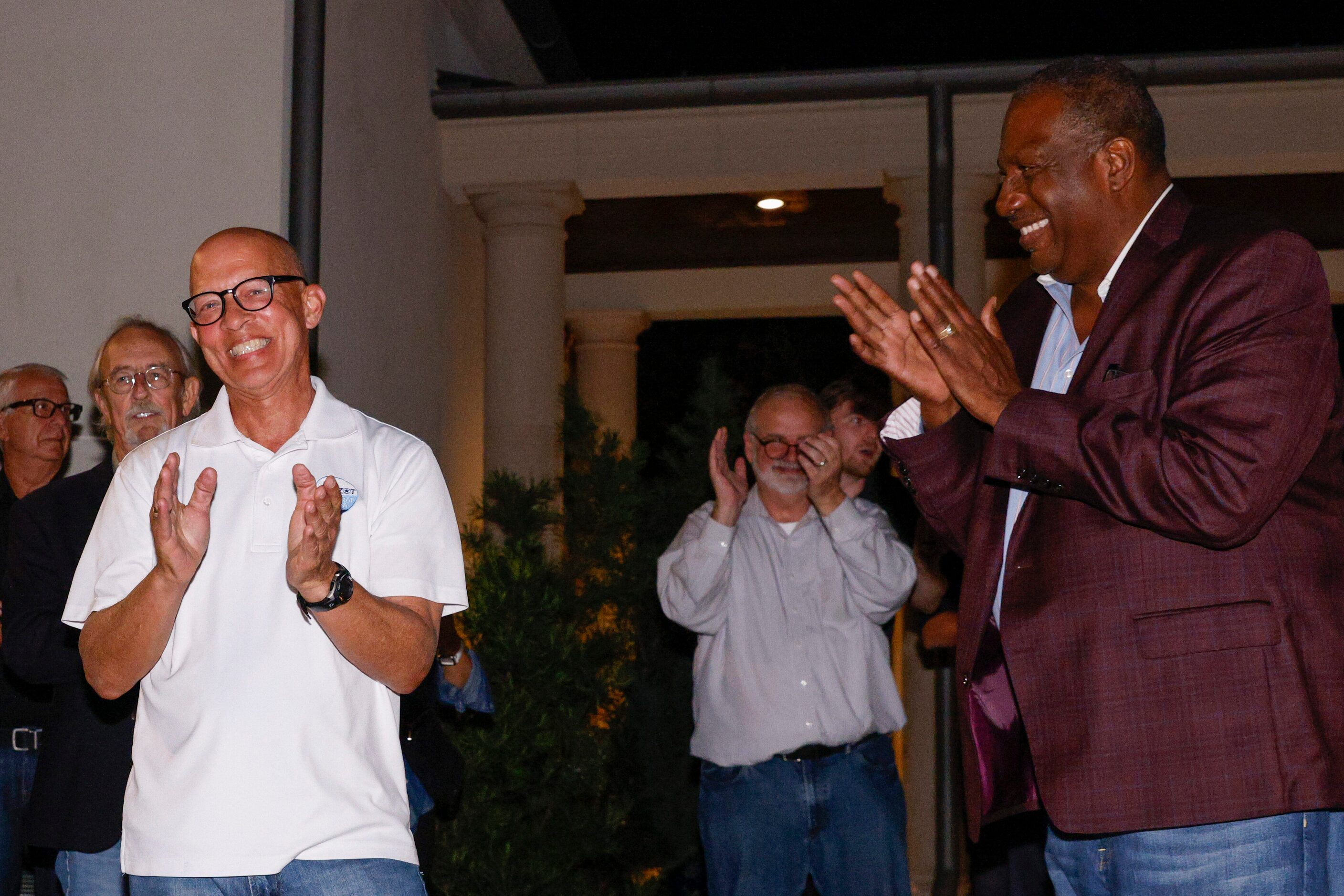 Dallas County District Attorney John Creuzot, a Democrat (left), laughs while being...