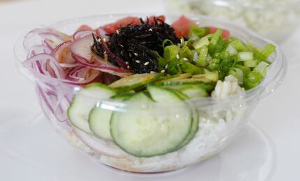 Poke Bop Classic with ahi tuna, red onion, scallions, hijiki seaweed, cucumber, kaiware...