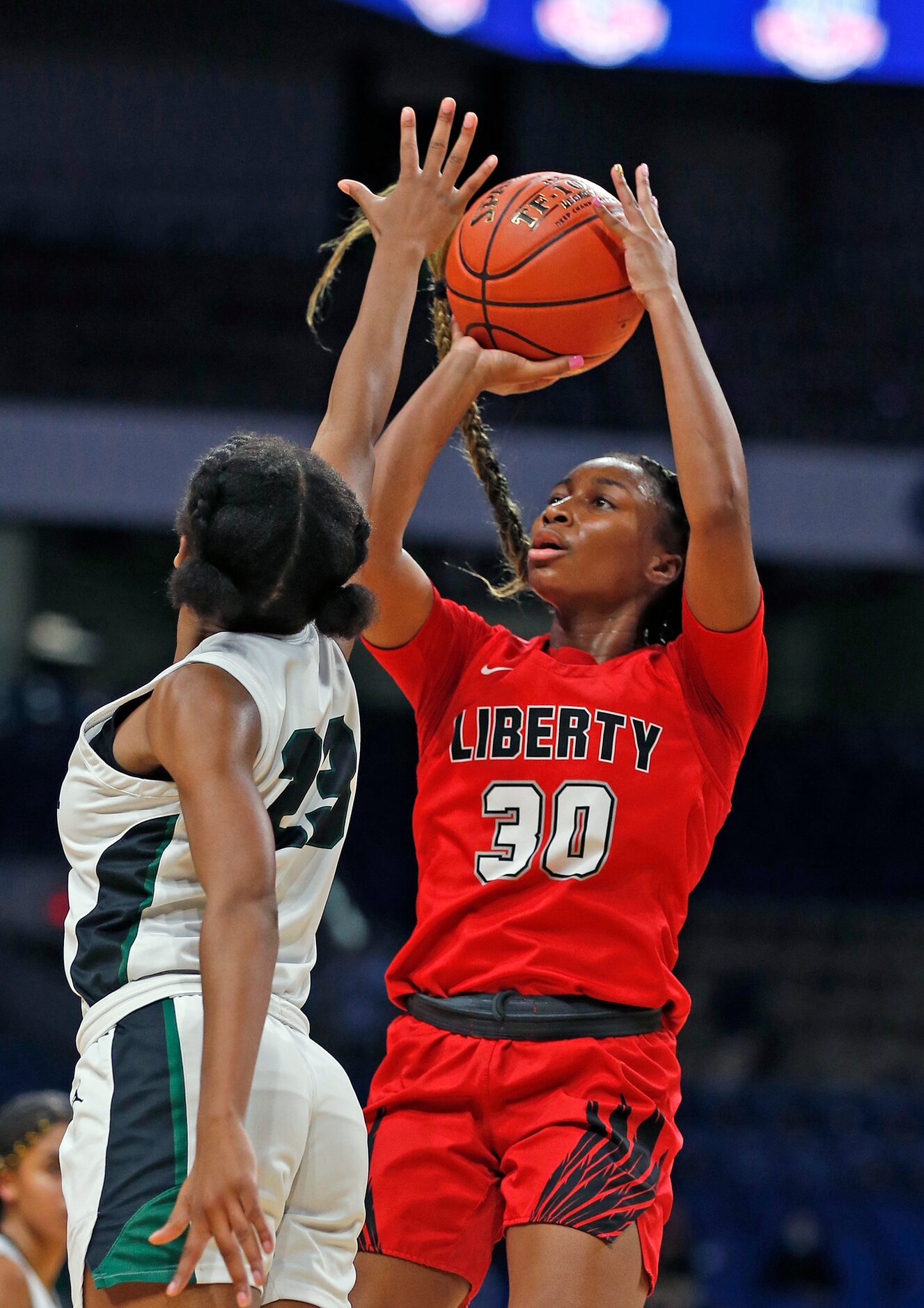 Frisco Liberty Jazzy Owens-Barnett #30 shoots over Cedar Park Alisa Knight #23. Frisco...