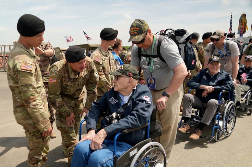 U.S. soldiers welcomed American D-Day veterans at Deauville airport in Normandy, France, on...