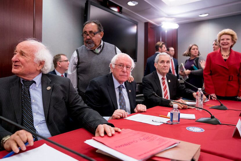 From left, Rep. Sander Levin, D-Mich., Rep. Raul Grijalva, D-Ariz., Sen. Bernie Sanders,...