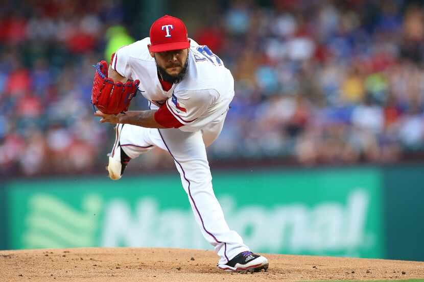 ARLINGTON, TX - AUGUST 19: Martin Perez #33 of the Texas Rangers throws in the first inning...