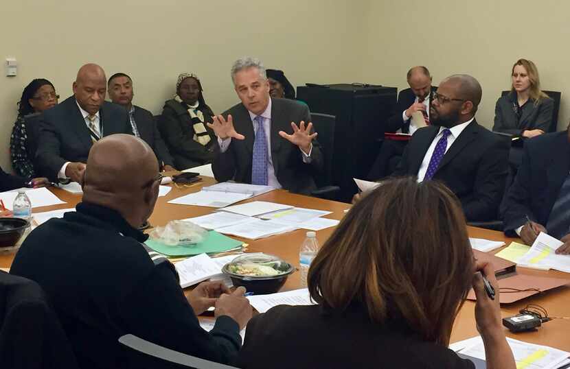 Catholic Charities of Dallas CEO David Woodyard addresses a housing finance board for the...