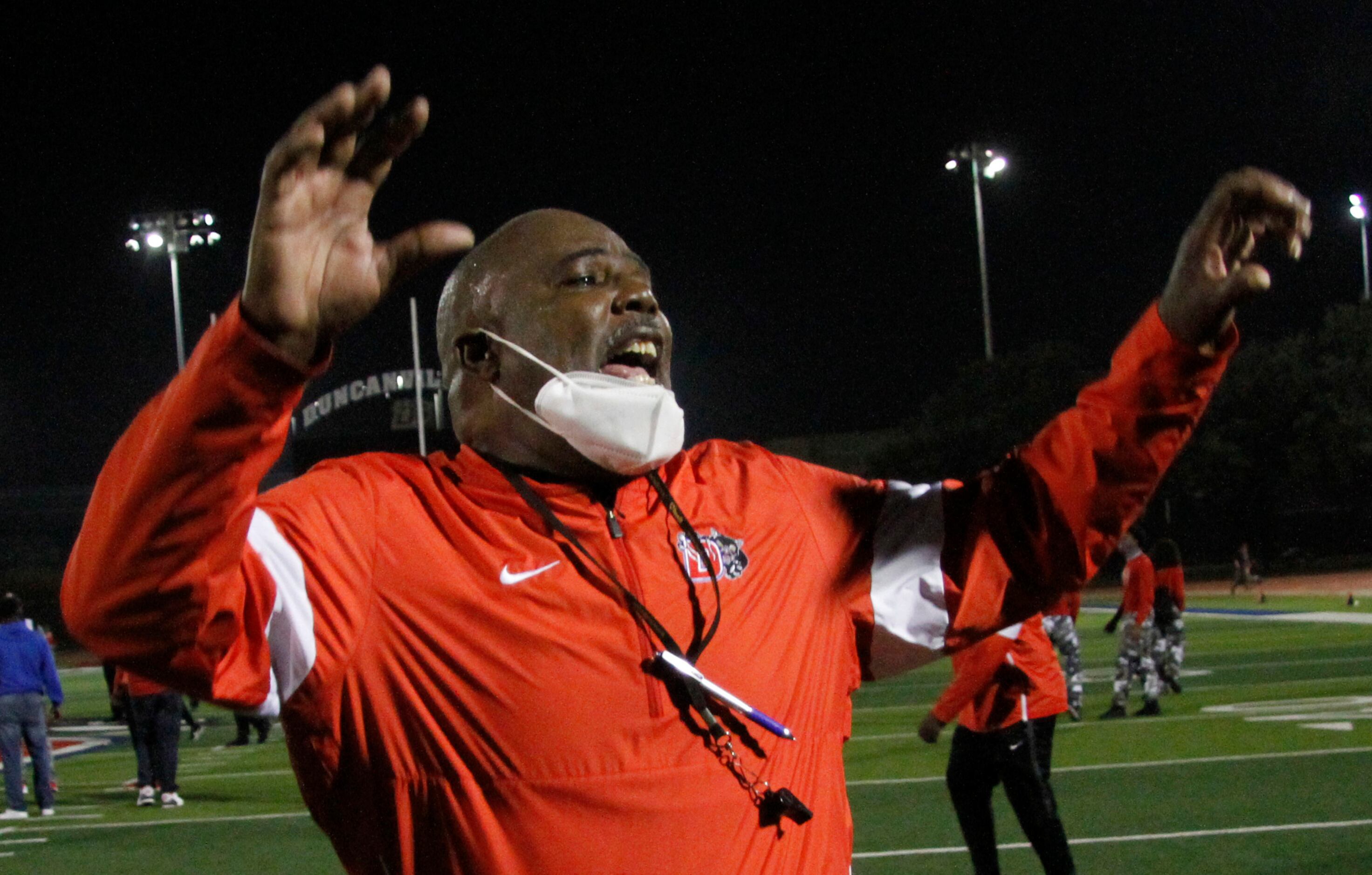 Duncanville head coach Reginald Samples gives praise to his players  following their 28-14...