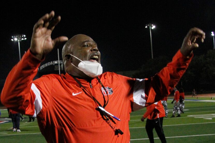Duncanville head coach Reginald Samples gives praise to his players  following their 28-14...