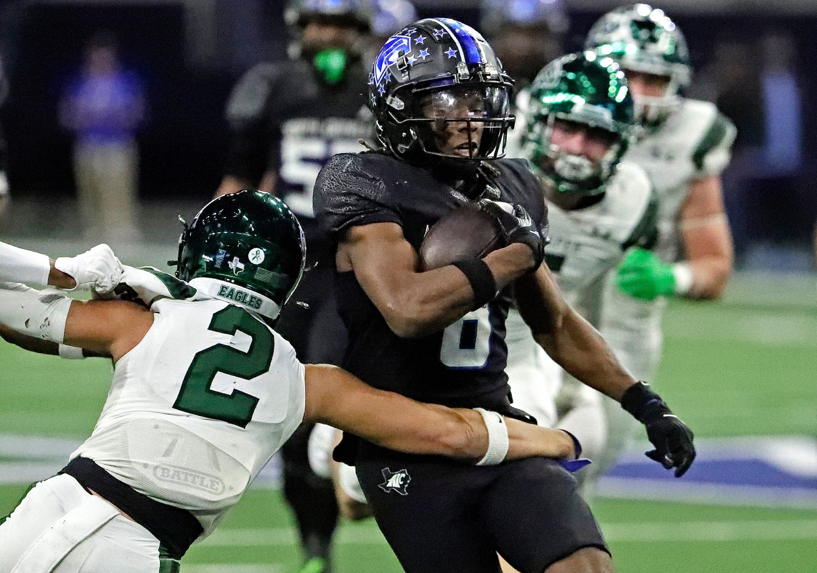 North Crowley High School running back Ashton Searl (8) is tackled by Prosper High School...