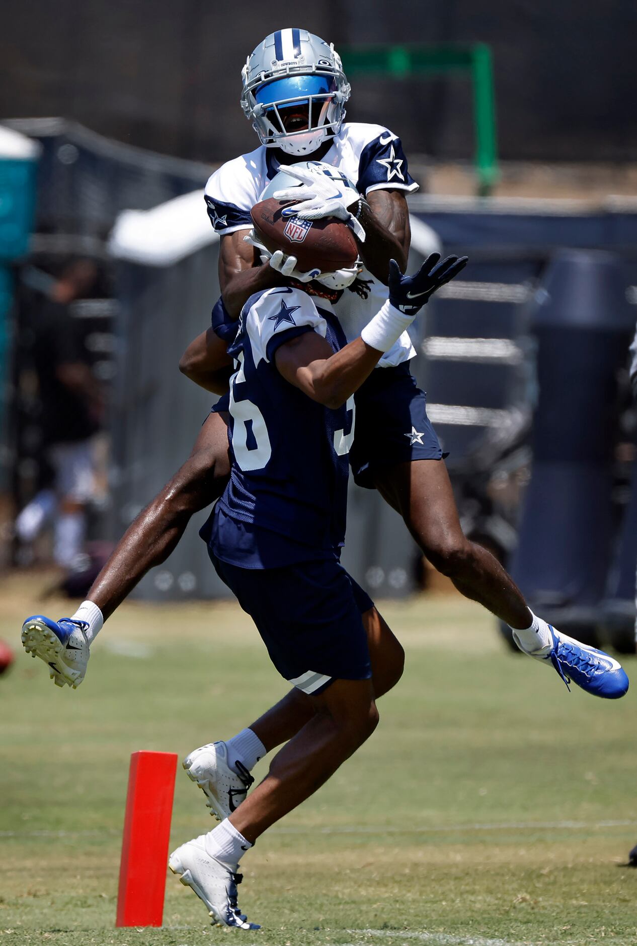 Dallas Cowboys wide receiver T.J. Vasher (16) goes up and over cornerback Isaac...