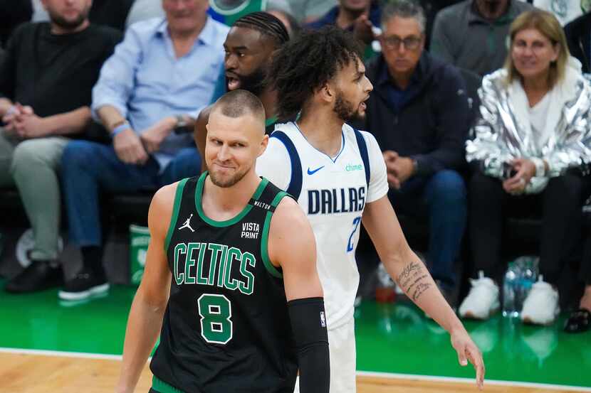 Boston Celtics center Kristaps Porzingis (8) reacts after being called for a foul during the...