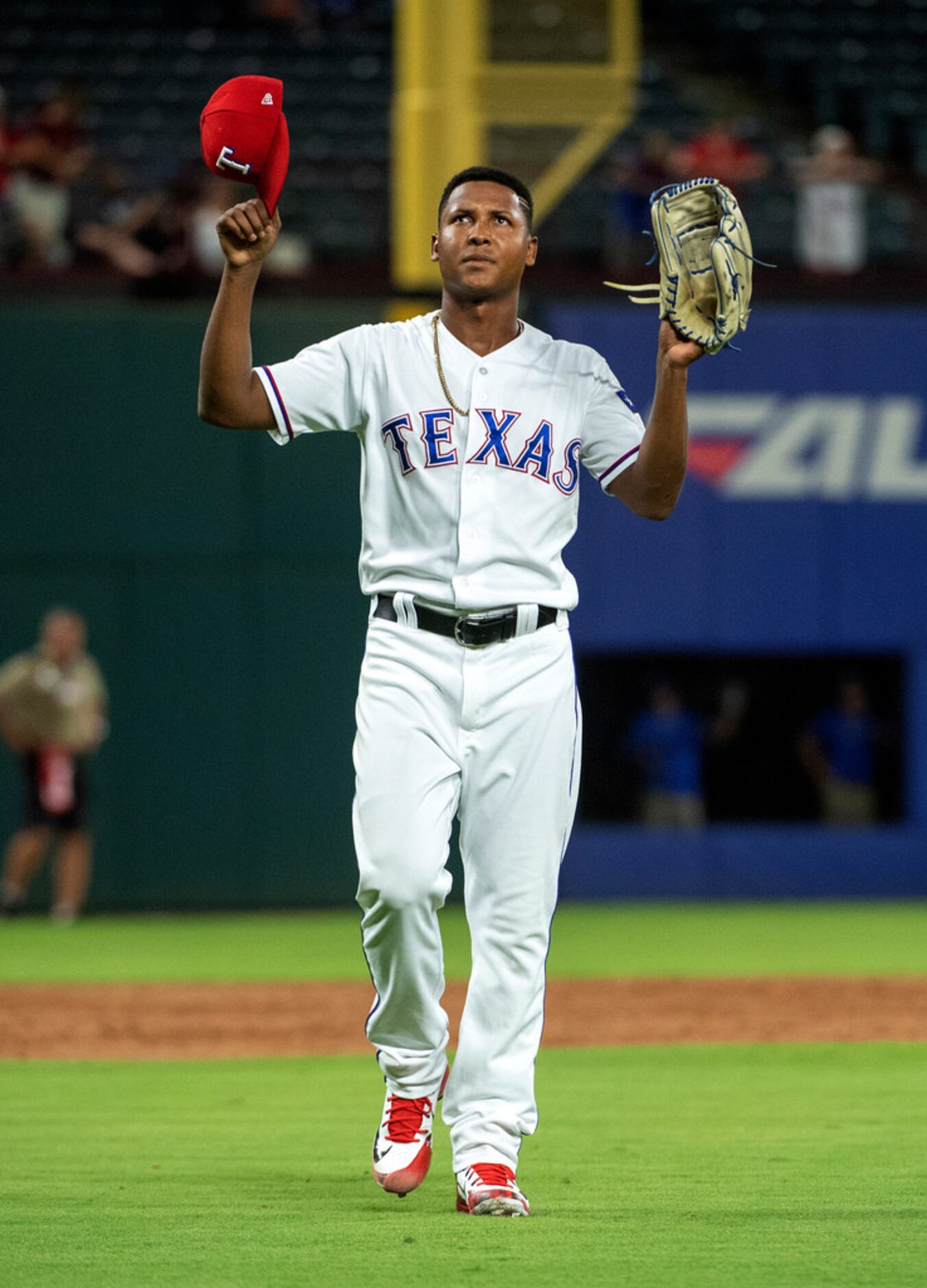 Texas Rangers relief pitcher Jose Leclerc throws up his hands as he leaves the field after...