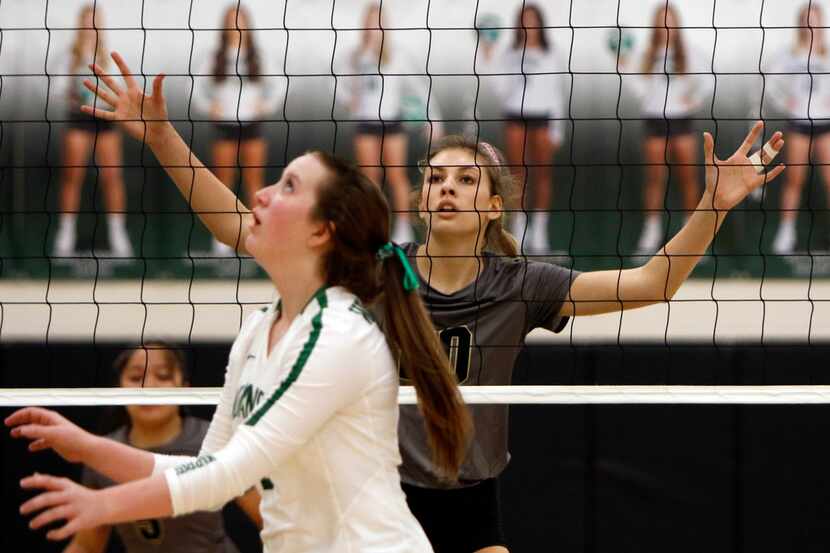 Mansfield outside hitter Molly Phillips (20) is a towering defensive presence as Waxahachie...