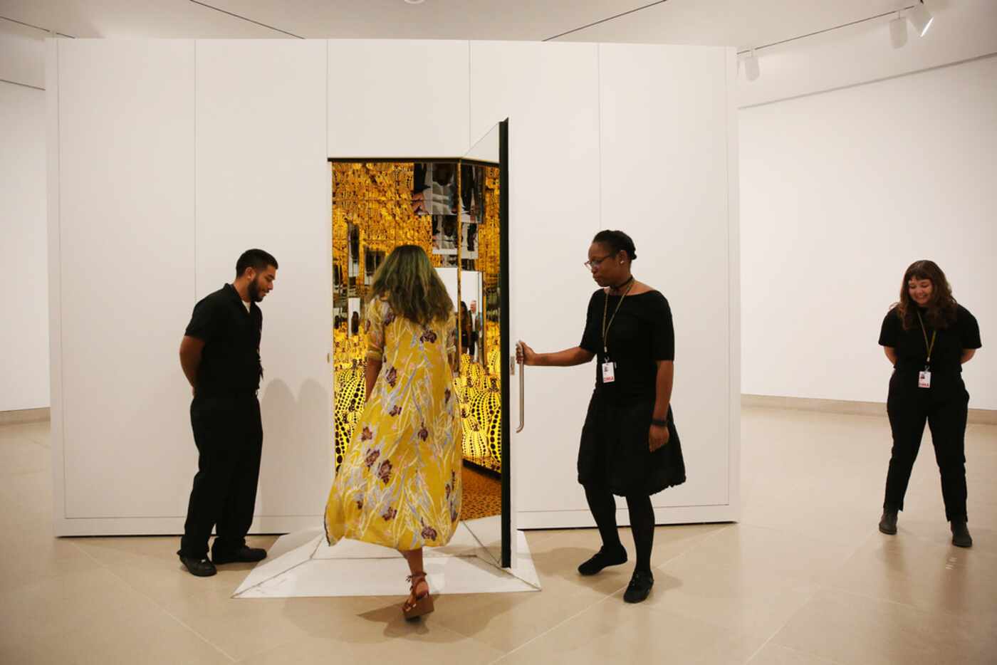 Guests enter during a preview of the exhibition 'Yayoi Kusama: All the Eternal Love I Have...