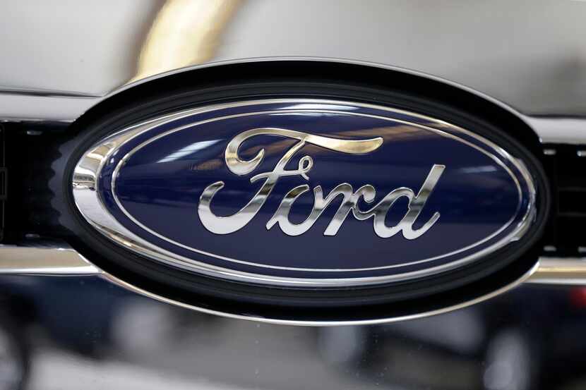 FILE - This file photo taken on Feb. 14, 2013 shows the Ford logo on the grill of a 2013...