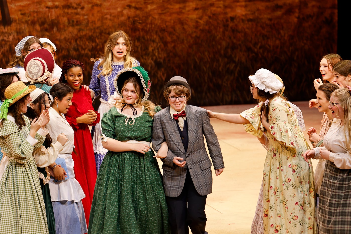 Cast member Max Hightower (center right) as Ali Hakim enters for his last scene during the...