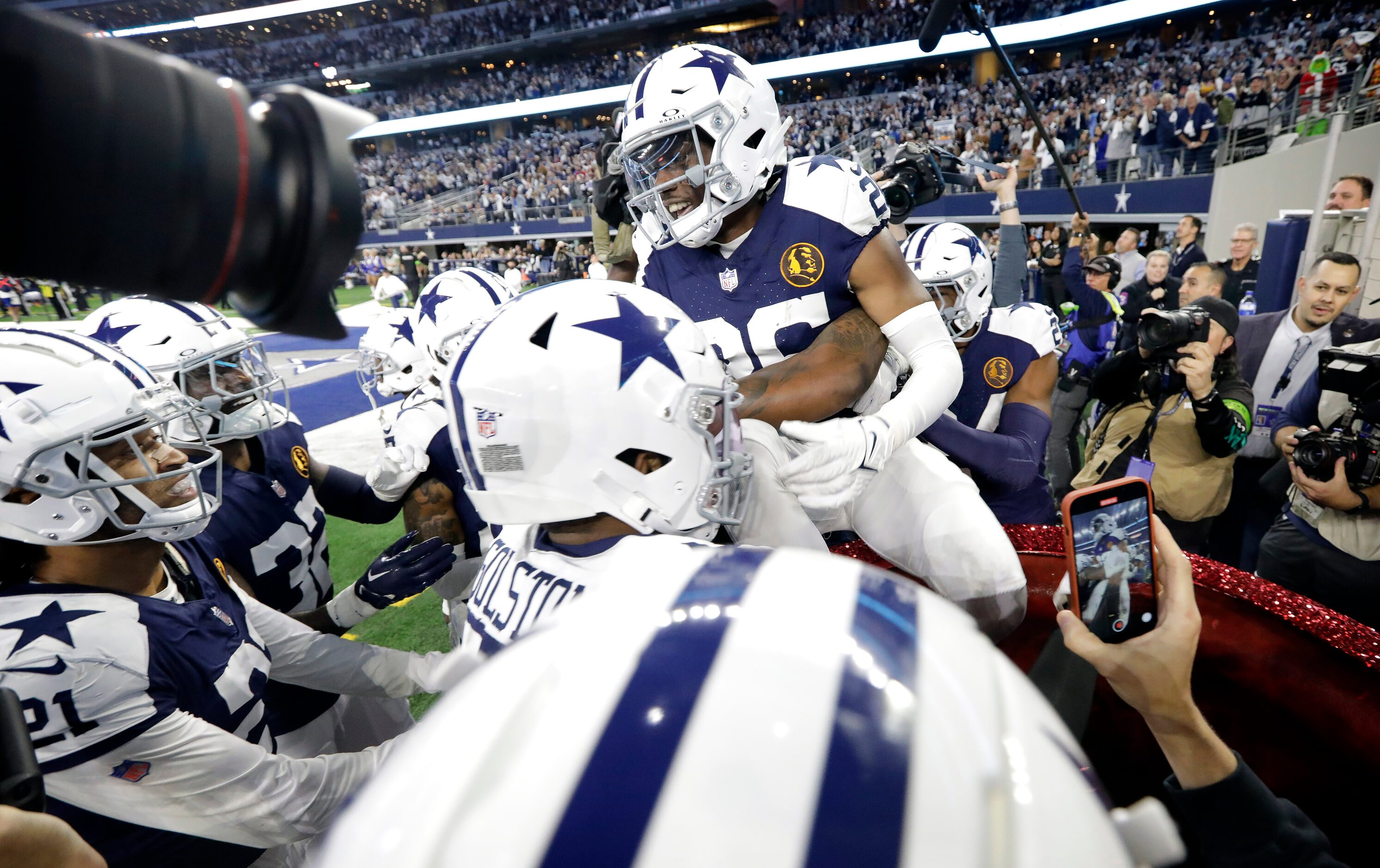 Dallas Cowboys cornerback DaRon Bland (26) is congratulated by teammates in the Salvation...