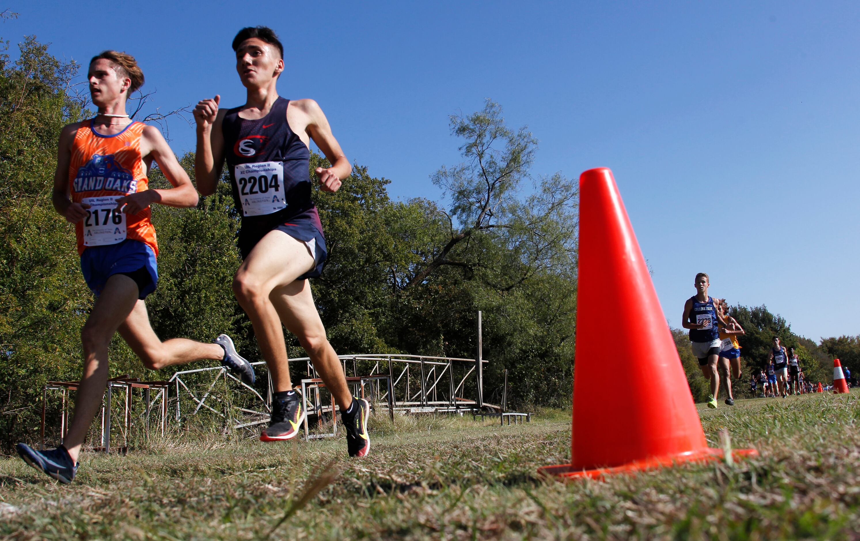 Runners compete in the boys race. The Class 6A Region ll cross country meet was held inside...