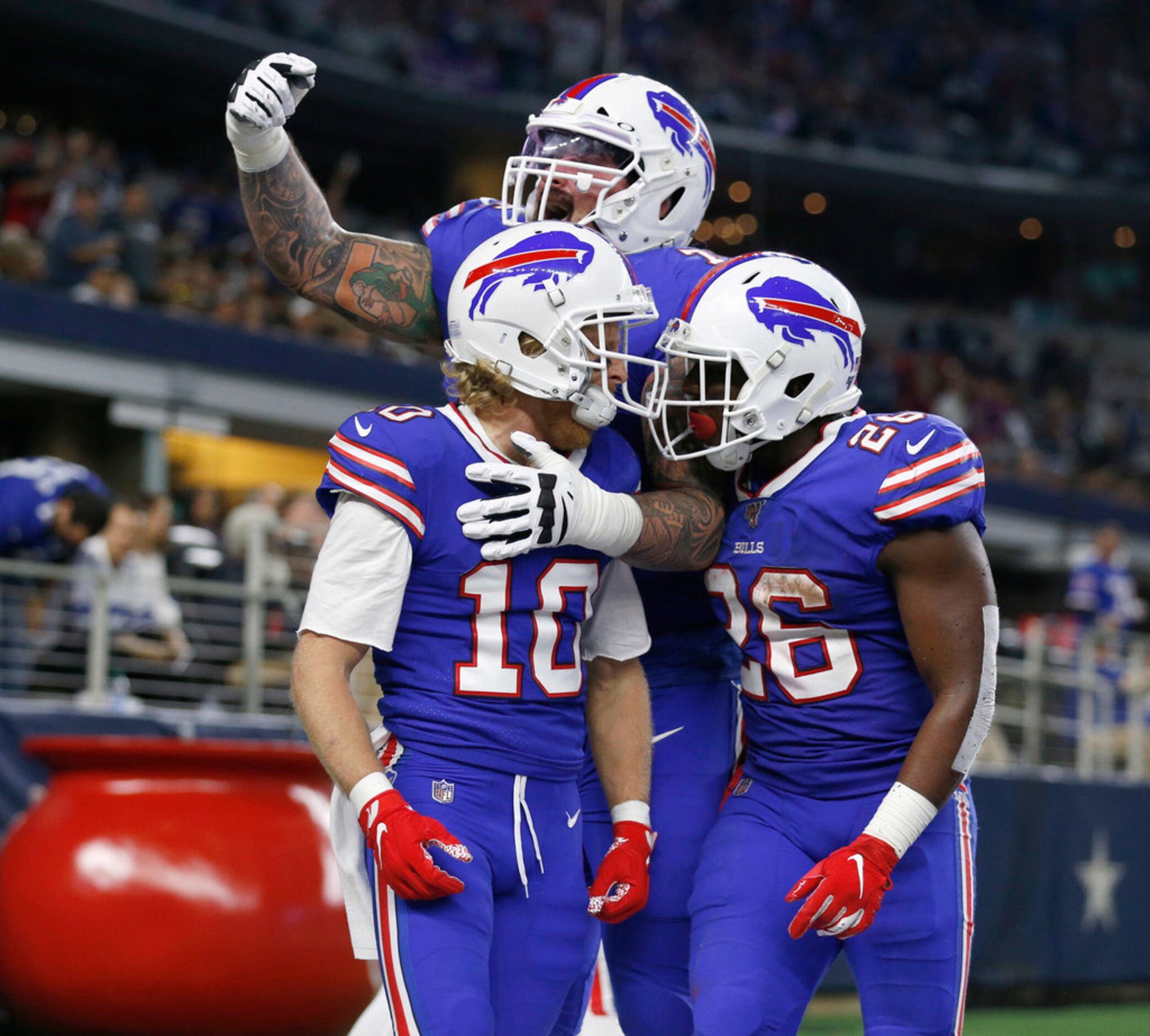 Buffalo Bills offensive guard Jon Feliciano (76) and Buffalo Bills running back Devin...