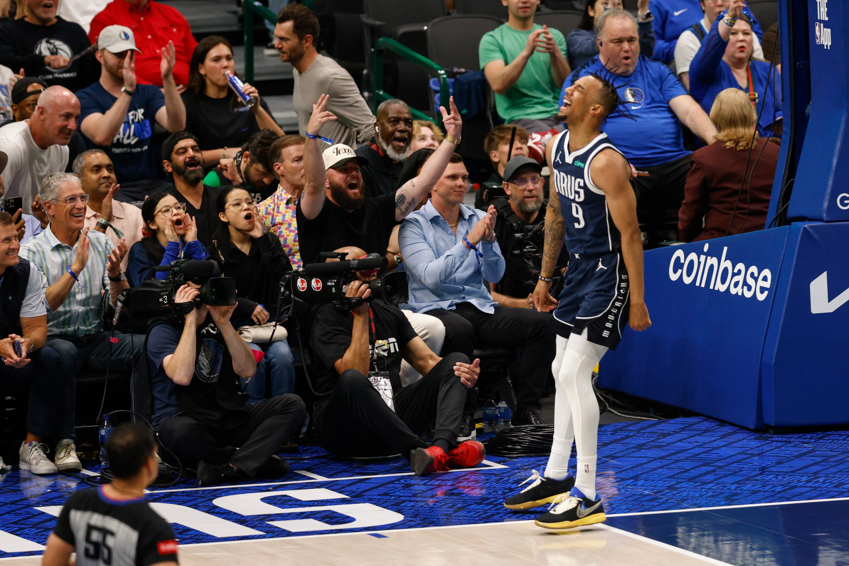 Dallas Mavericks guard A.J. Lawson (9) yells after dunking the ball during the second half...