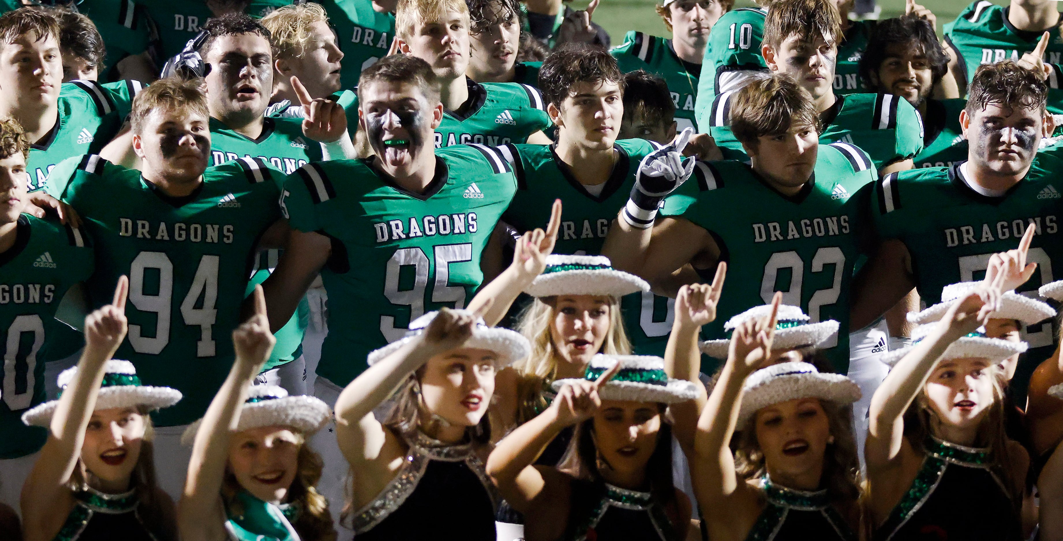 The Southlake Carroll football and drill team sing the school song following their 38-35 win...