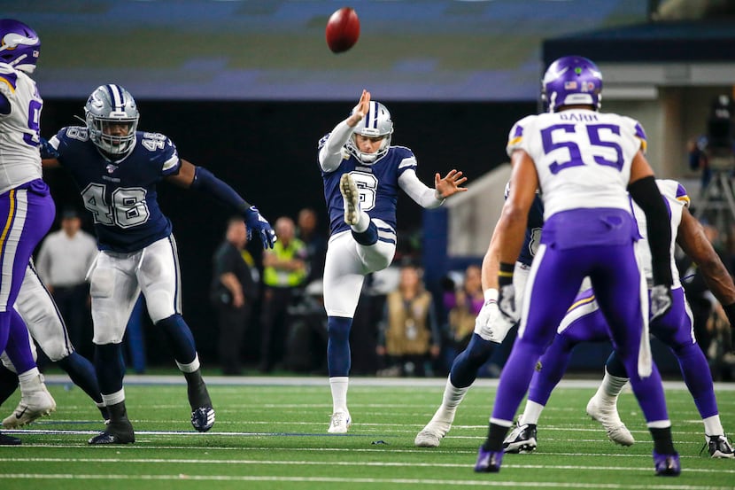 Dallas Cowboys punter Chris Jones (6) sends the ball airborne during the first quarter of an...