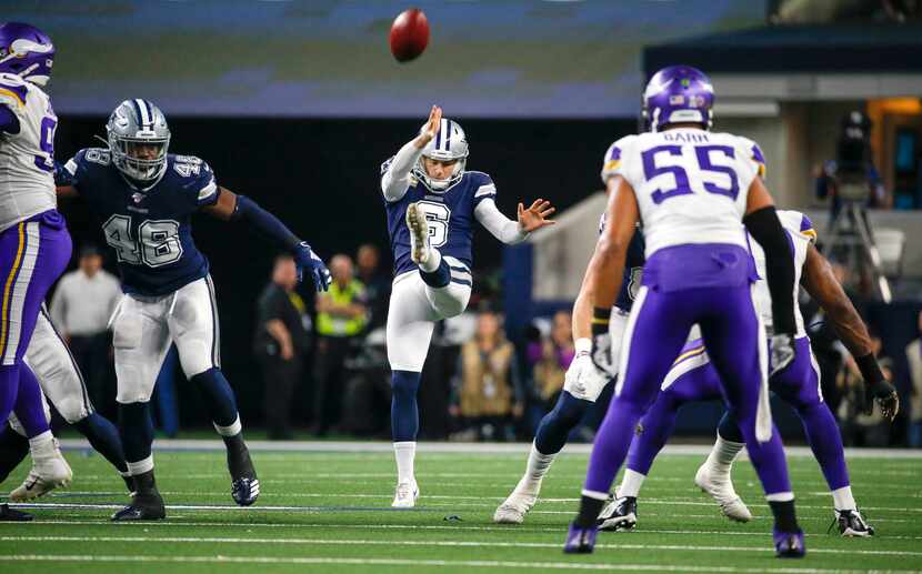 FILE - The Cowboys' Chris Jones (6) punts the ball during the first quarter of a game...