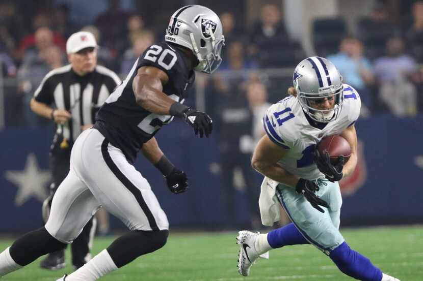 FILE - Dallas Cowboys receiver Cole Beasley (11 ) gets by Oakland Raiders defensive back Obi...