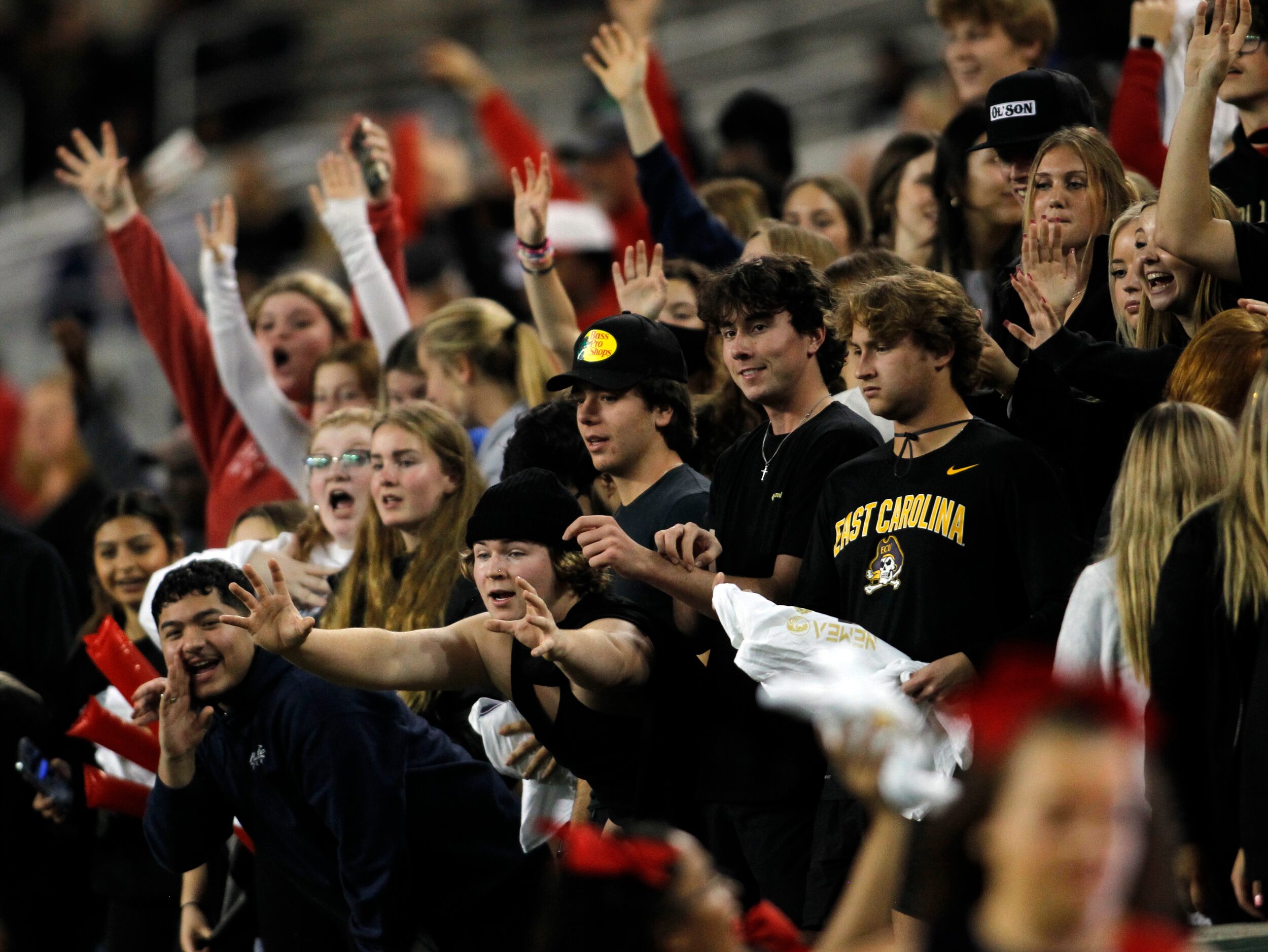 Denton Ryan fans filling the student section anticipate a chance at snagging a free t-shirt...