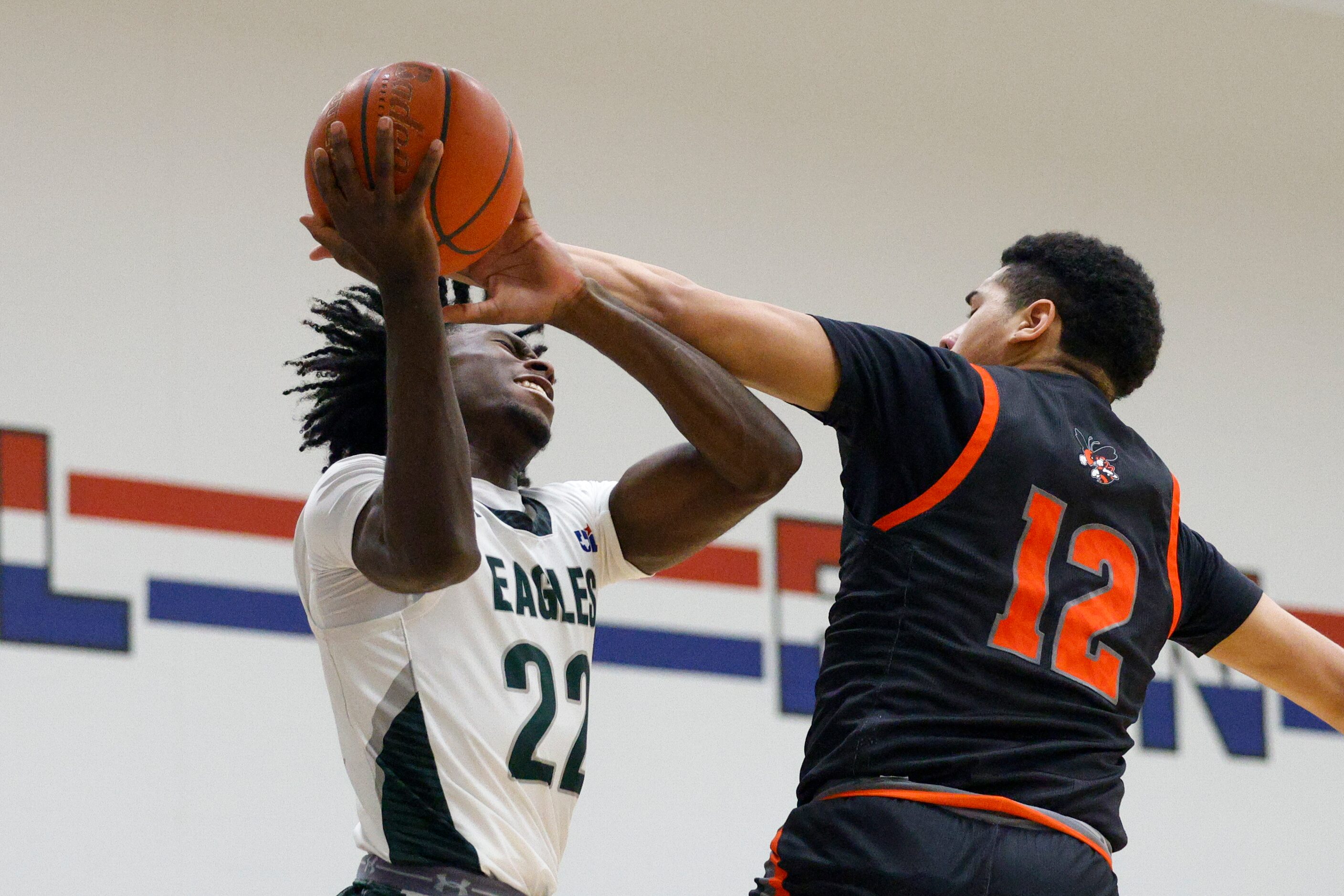 Rockwall's Torin Cantu (12) fouls Mansfield Lake Ridge's Matthew Alexander (22) as he...