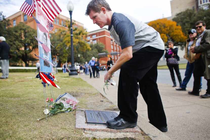 Wayne Adam of Toronto, Canada, in town on business, paid his respects Thursday in downtown...