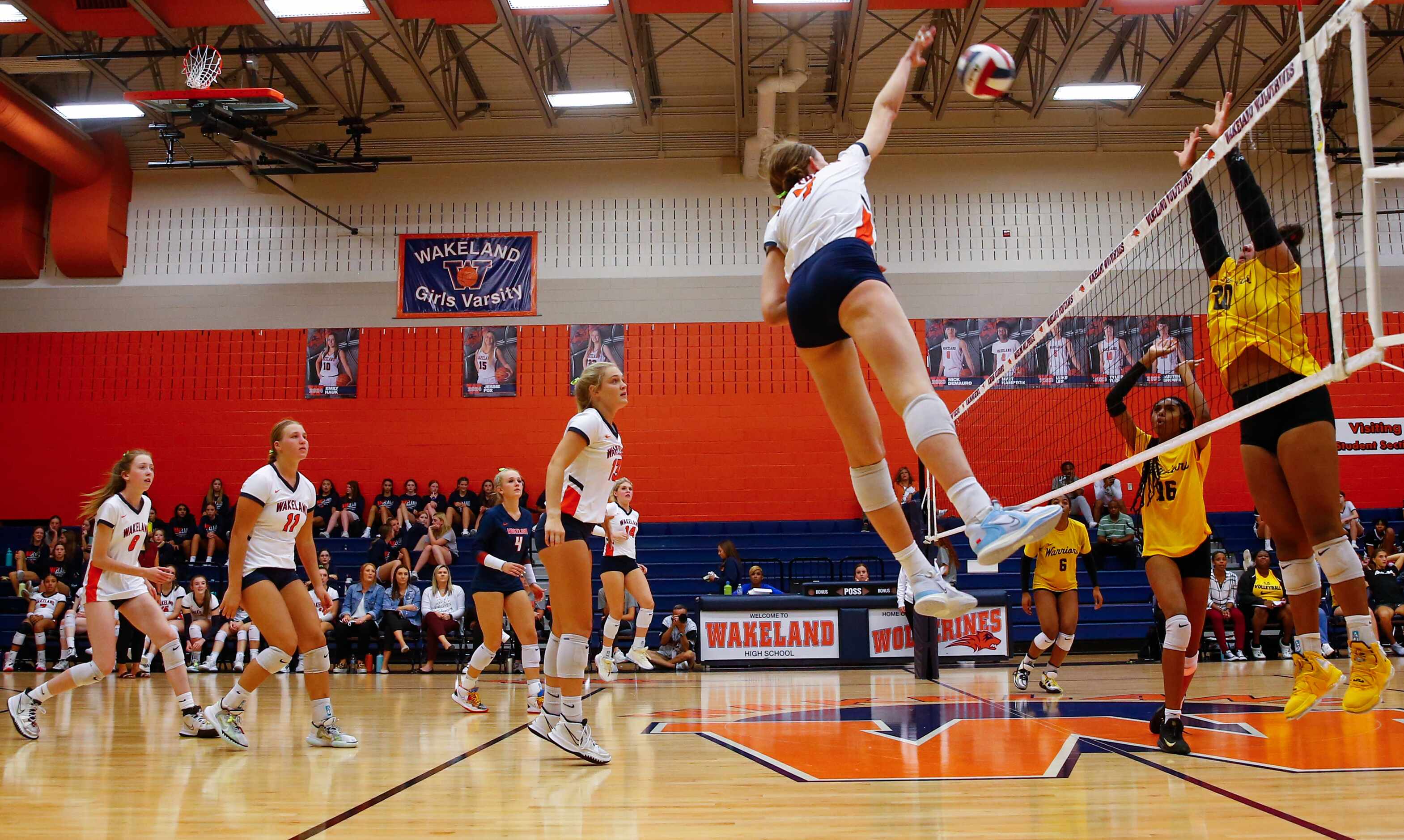 Frisco ISD’s Wakeland High School volleyball player Jessica Jones (7) spikes the ball over...