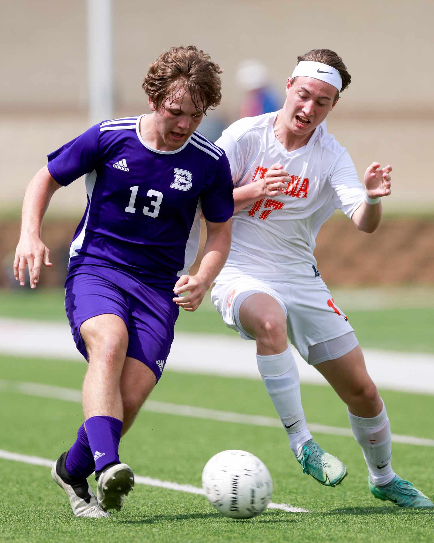 Boerne’s Logan Walter (13) and Celina defender William Brown (17) reach for a loose ball...
