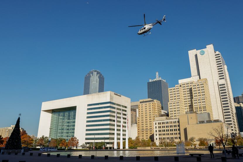 The Dallas Police Department’s newly acquired helicopter flies over downtown after a...