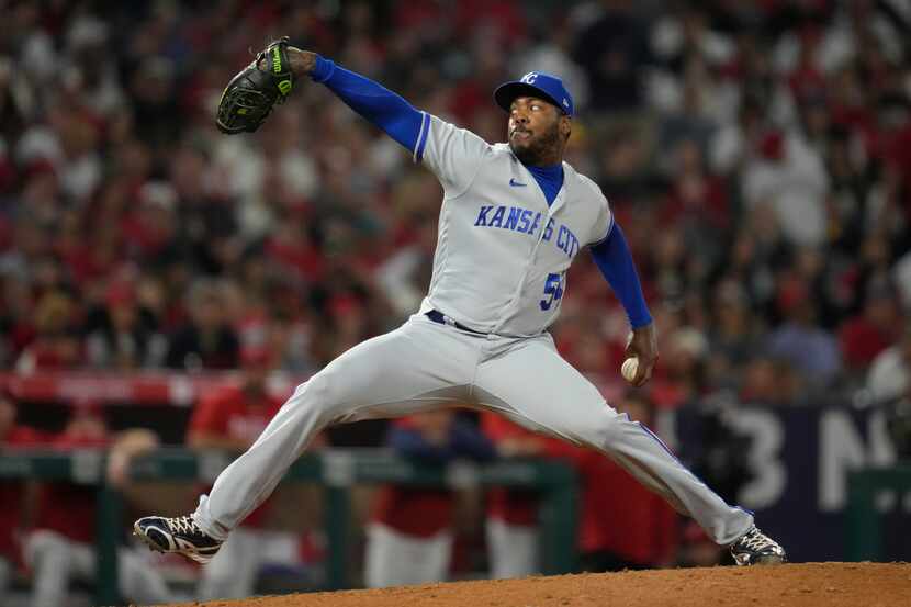 Kansas City Royals relief pitcher Aroldis Chapman (54) throws during the seventh inning of a...