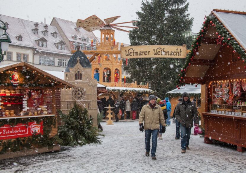 Snow falls on Weimar's Christmas Market in Germany.