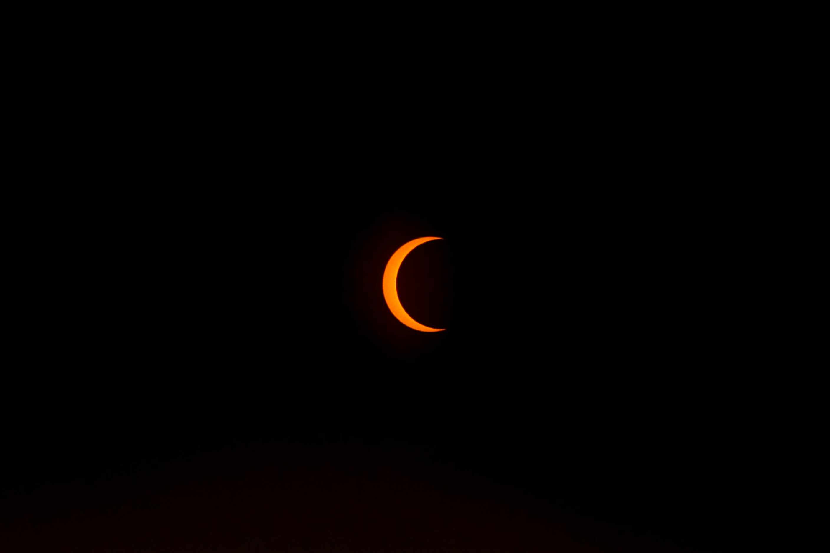 The peak of the annual solar eclipse is seen on Saturday, Oct. 14, 2023, from Perot Museum...