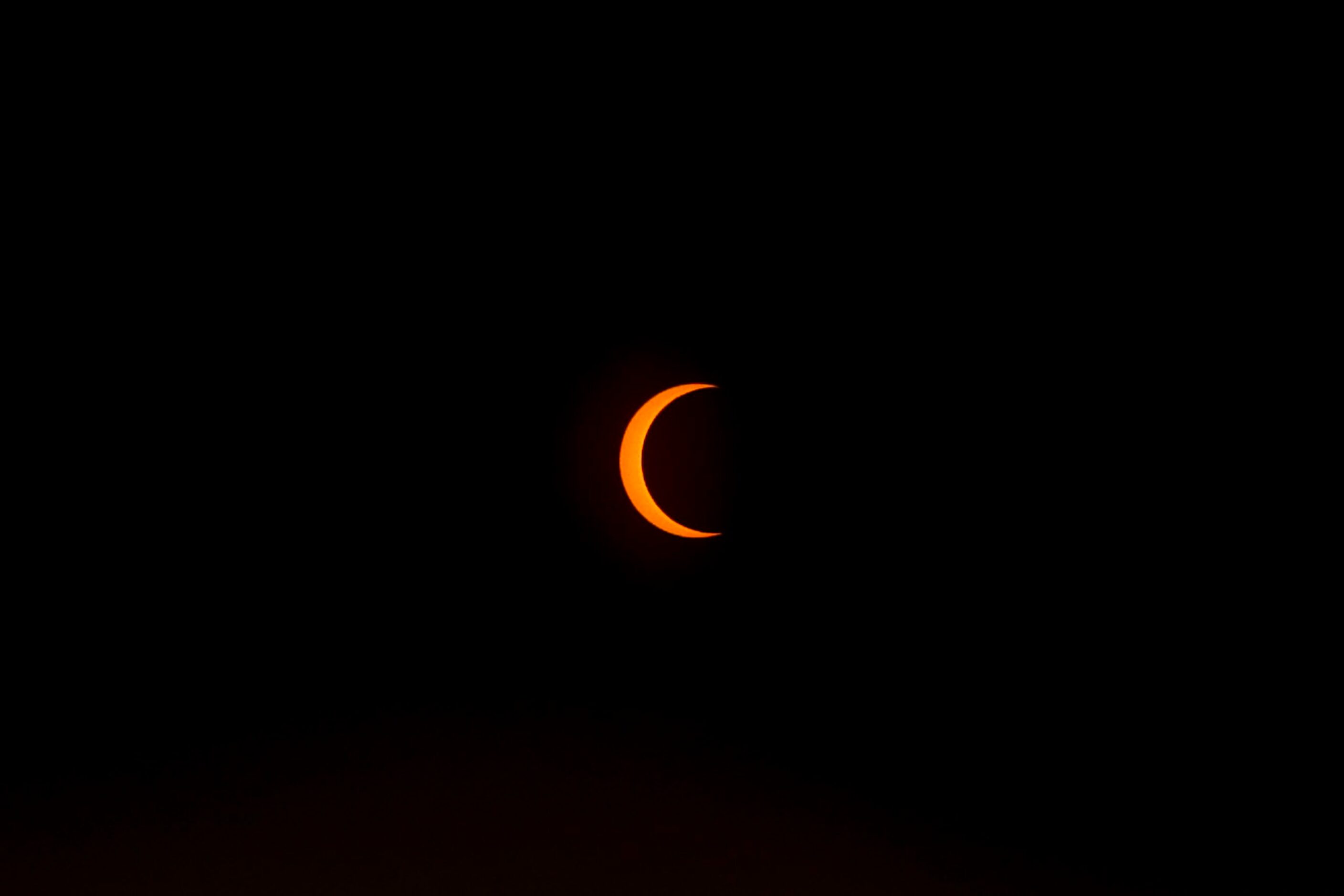 The peak of the annual solar eclipse is seen on Saturday, Oct. 14, 2023, from Perot Museum...