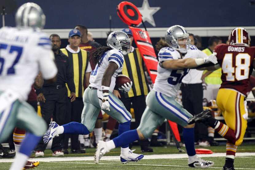 Dallas Cowboys wide receiver Dwayne Harris (17) returns a punt for a touchdown against the...