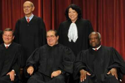  Justice Antonin Scalia (front center), above in a group picture of the Supreme Court in...