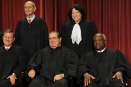  Justice Antonin Scalia (front center), above in a group picture of the Supreme Court in...