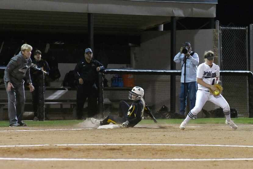 Avery Markley Plano East Lady Panther (10) reaches third base safe as Megan O'Boyle Guyer...