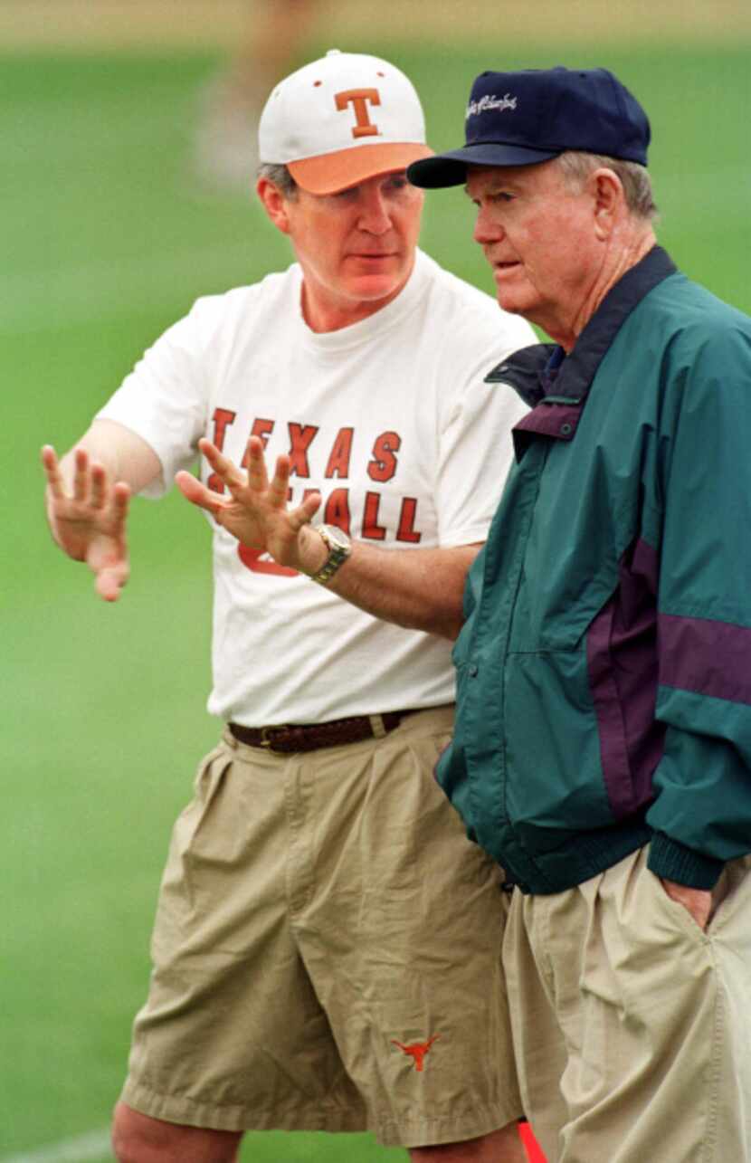 University of Texas head football coach Mack Brown talks with former coach Darrell Royal...