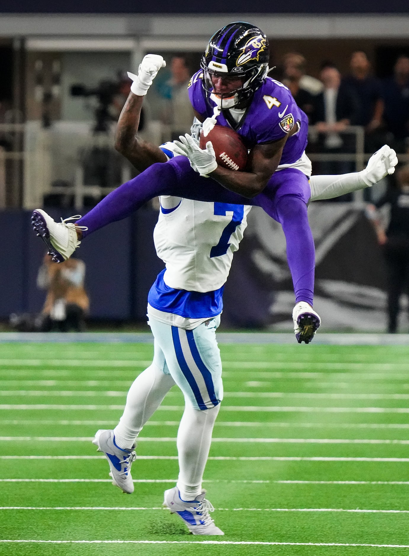 Baltimore Ravens wide receiver Zay Flowers (4) makes a catch for a first down with 2:36 left...