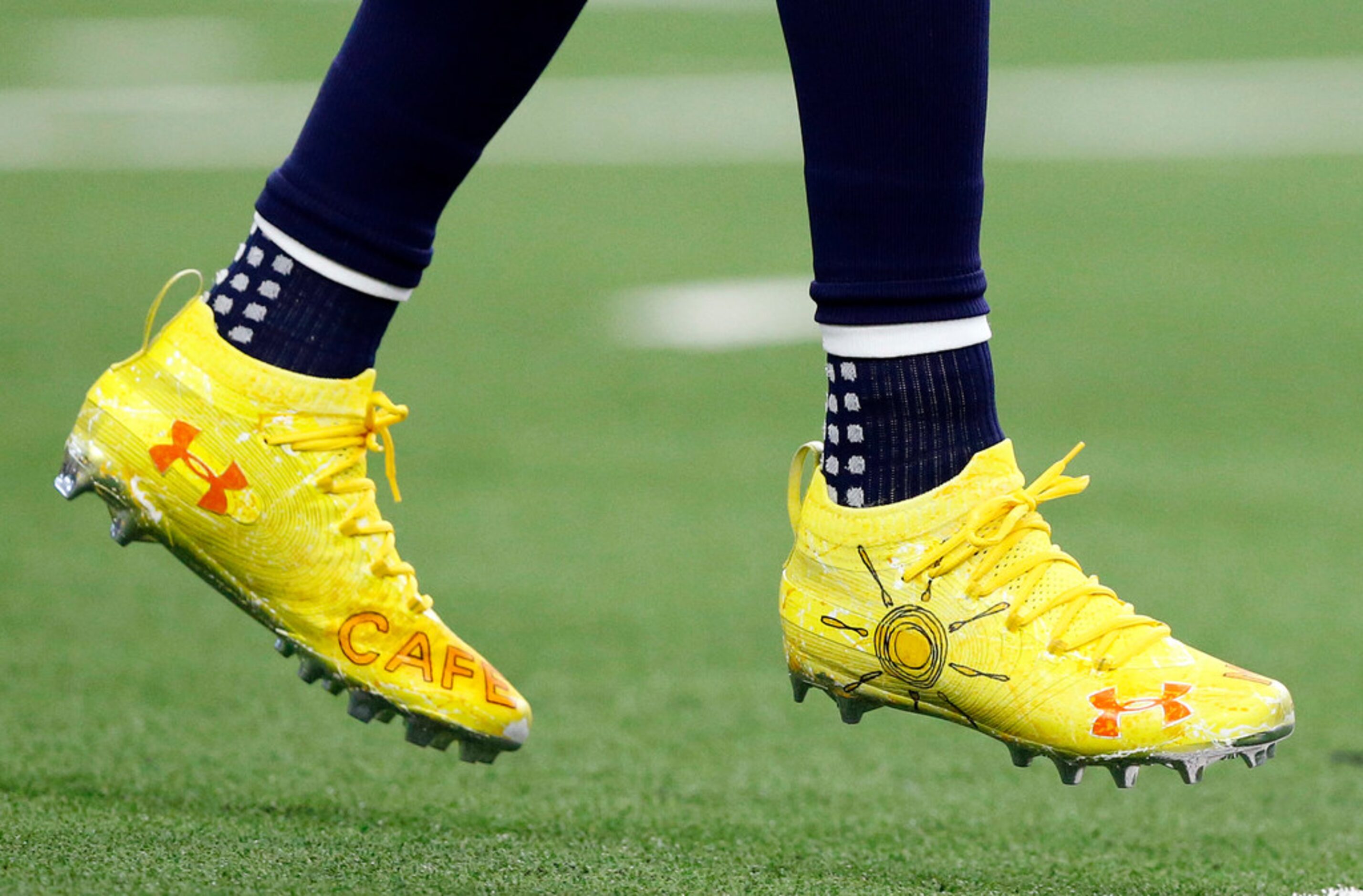 Dallas Cowboys wide receiver Randall Cobb (18) wears brightly colored shoes during pregame...