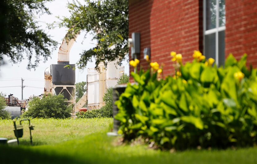 Homes, schools and businesses have sprouted up around the asphalt plant over the years....